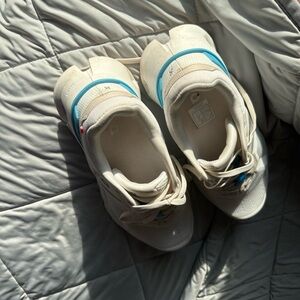 On Running Cream and White Sneakers